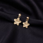 Real 14K gold flower charm detail view – solid gold quinceañera pendant not plated
