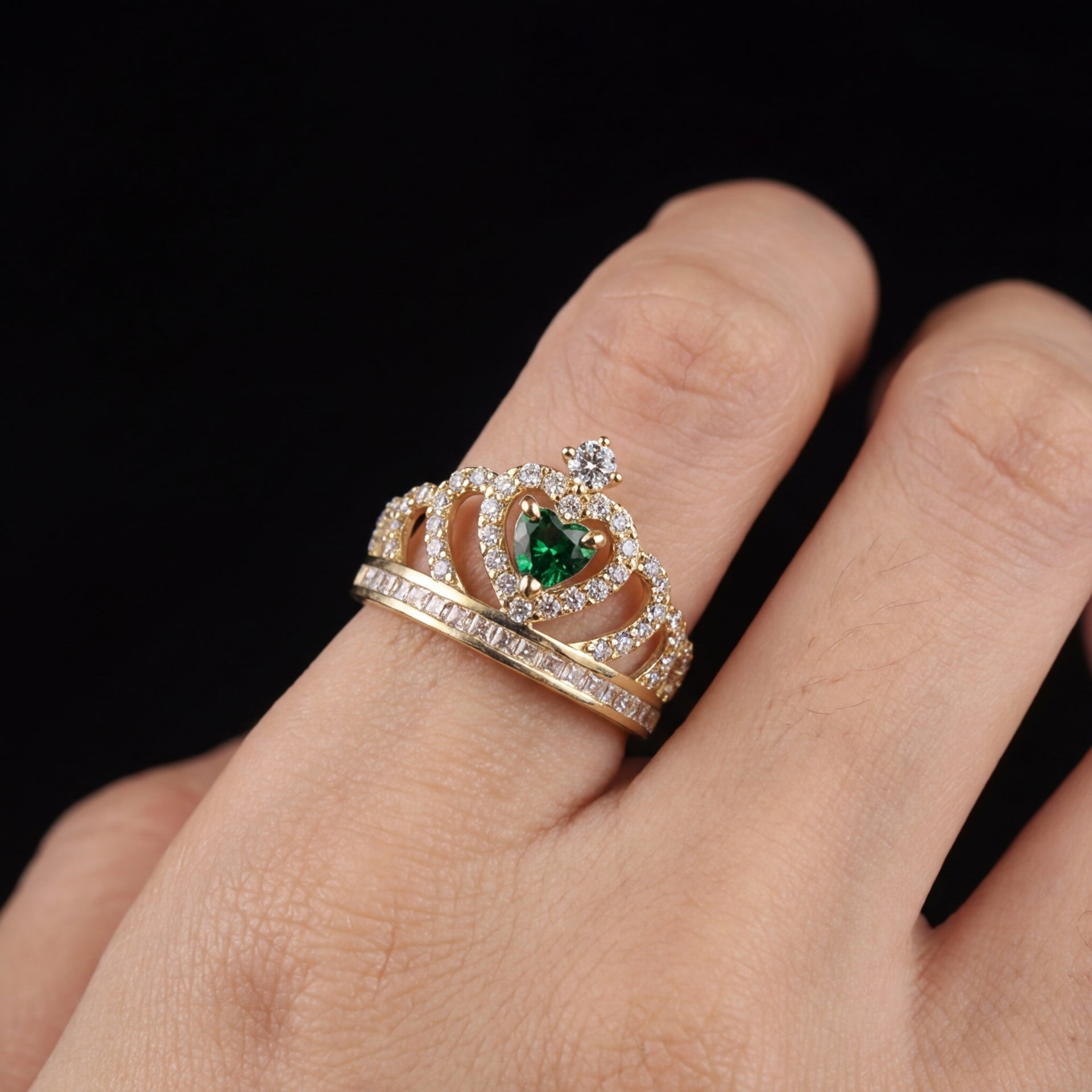 14K gold tiara quinceañera ring with green gem on cream background – solid gold